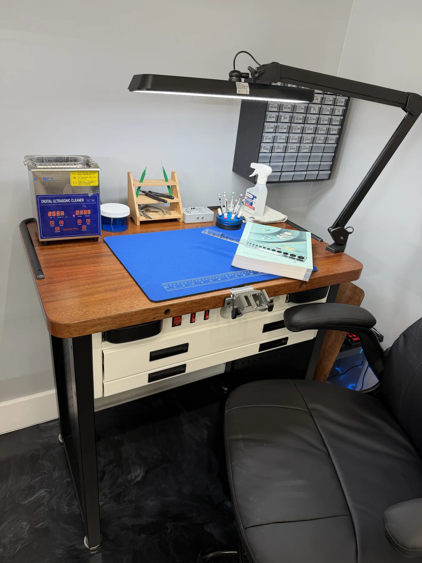 Our in-store jewelry service workbench with tools and task light